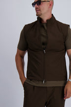 Les Brutes Tech Bodywarmer in dark brown. Perfect for layering and a casual or smart look. Premium quality with stretch