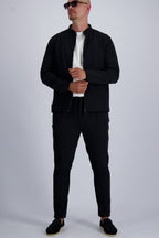 Les Brutes luxury Tech suit in black. A matching set including a Tech Jacket and trousers for men. 