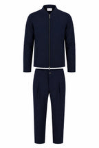 Les Brutes matching tech suit. A jacket and matching trousers in dark brown. Premium quality, crafted with luxury technical fabrics. 