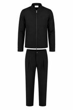 Les Brutes matching tech suit. A jacket and matching trousers in dark brown. Premium quality, crafted with luxury technical fabrics. 