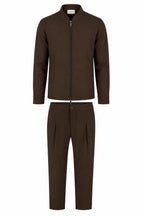 Les Brutes matching tech suit. A jacket and matching trousers in dark brown. Premium quality, crafted with luxury technical fabrics. 