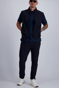 Les Brutes Tech set in Navy. Bodywarmer and matching trousers with a minimalist design. Crafted with premium fabrics for men who like timeless fashion. 