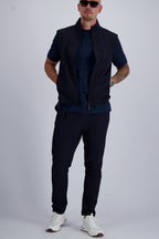 Les Brutes Tech set in Navy. Bodywarmer and matching trousers with a minimalist design. Crafted with premium fabrics for men who like timeless fashion. 