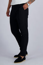 Les Brutes Tech stretch trousers in black. Premium comfortable trousers for men with minimalist design
