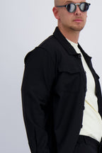 Luxury wool tech overshirt with buttons and chest pockets in black. Crafted with premium fabrics. A timeless design mens wear