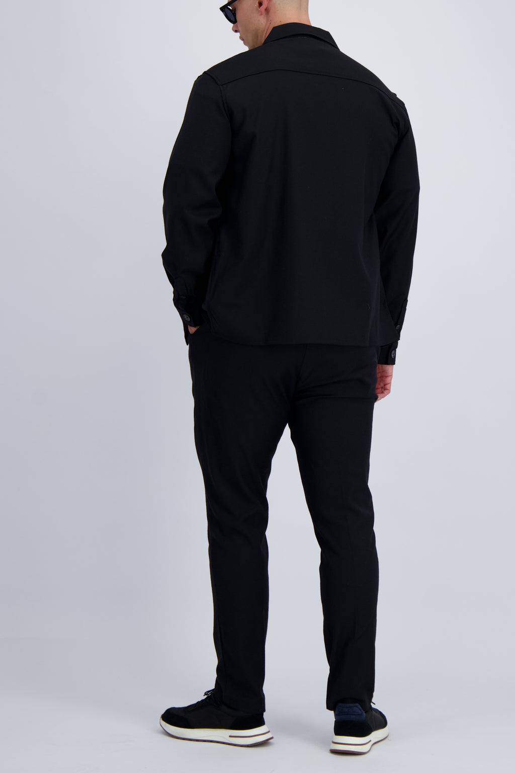 Luxury wool tech overshirt with buttons and chest pockets in black. Crafted with premium fabrics. A timeless design mens wear