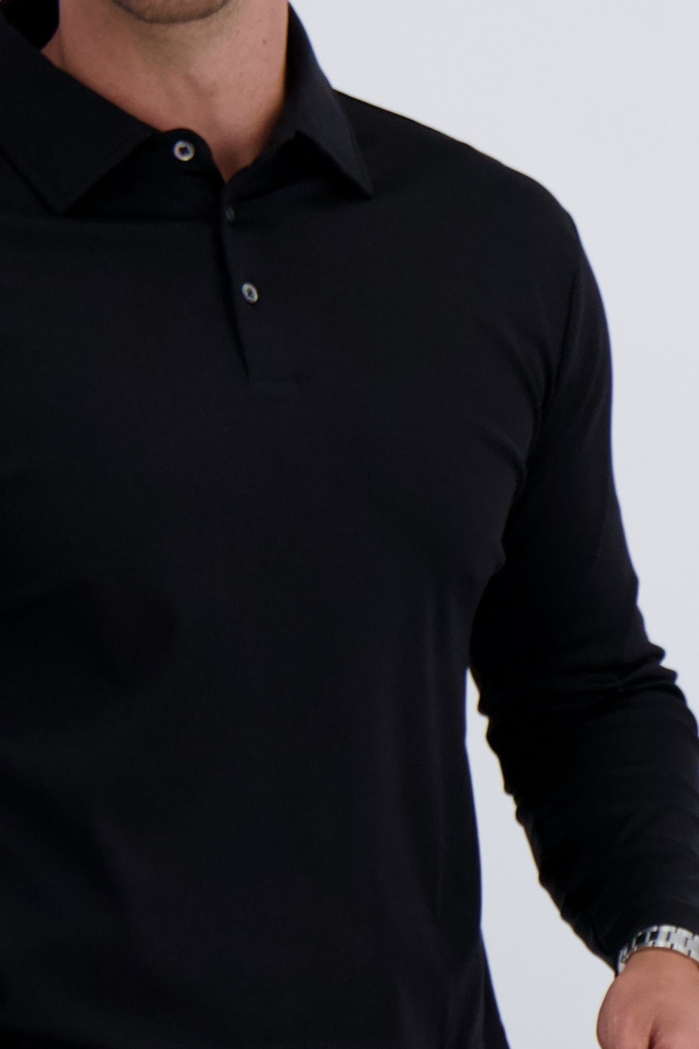 Detail of premium polo long sleeve mercerised cotton in black